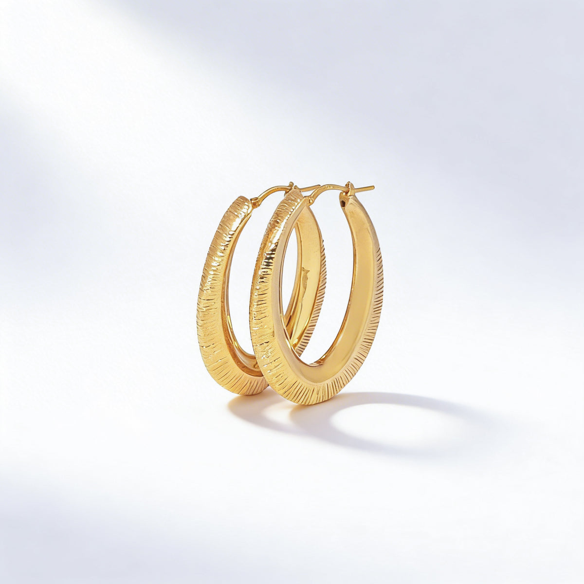 Gold textured hoop earrings in 925 sterling silver